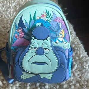 Authentic Disney parks Loungefly Alice and Wonderland bag.